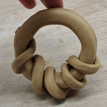 A ring of clay coils wrapped around each other