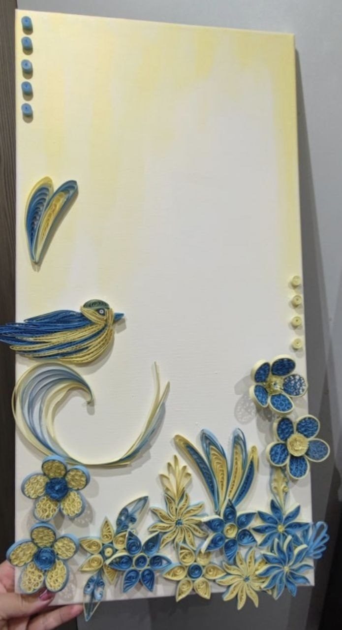 Blue and cream paper-quilling flowers and a bird on canvas